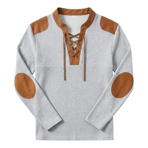 Mens vintage waffle knit long sleeve henley shirt with contrast suede patch details.
