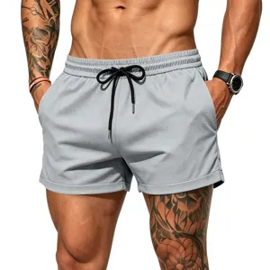 Men's breathable mesh athletic shorts with black drawstring and pockets for beach and gym.
