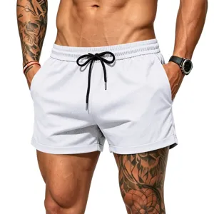 Close-up detail of white mesh athletic shorts for men with black adjustable drawstring.