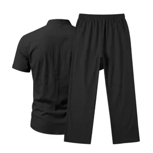 Black linen short sleeve shirt and straight pants set detail view, casual comfort spring wear.