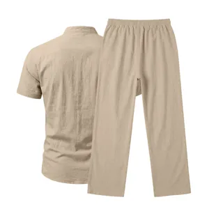 Detail view of casual men's linen short sleeve shirt and long trousers set in khaki.