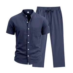 Detailed view of men's linen short sleeve henley shirt and matching straight trousers set.