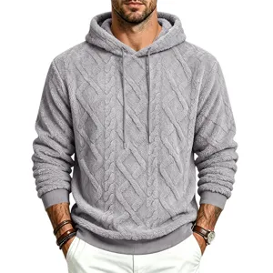 Close-up detail of cozy gray fleece hooded sweatshirt with cable knit texture for men