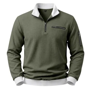 Men's waffle knit long sleeve polo sweatshirt with half zipper, contrast collar and pockets.