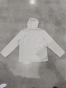 Men light hooded windbreaker jacket back view, casual outdoor athletic apparel detail shot.