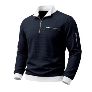 Men's waffle knit quarter zip long sleeve polo sweatshirt with contrast color trim.