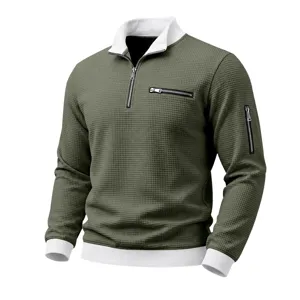 Detail view of men's waffle knit 1/4 zip sweatshirt with contrast collar and black zippers.