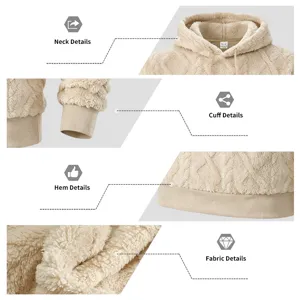 Detailed close-up of the plush fleece hoodie showing the jacquard texture and quality cuffs.