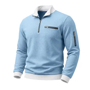 Waffle knit quarter zip pullover detail with contrasting white collar and stylish zipper pockets.
