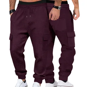 Pantalón de chándal cargo para hombre de punto waffle casual con cordón y bolsillos.