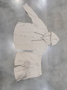 Close-up detail view of casual long sleeve hooded shirt and shorts linen set for men.