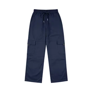 Detailed view of dark blue casual cargo pants with multiple functional pockets and drawstring.