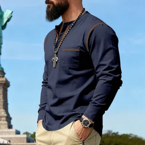 Detailed view of men's long sleeve henley t-shirt with contrast stitching and chest pocket.