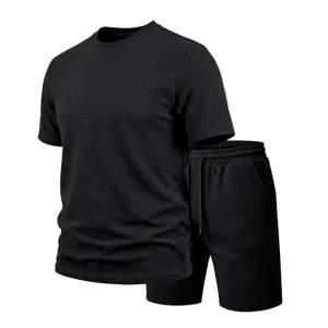 Detailed view of mens summer textured short sleeve t-shirt and shorts casual set in black color.