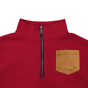 Close-up detail of men's red half-zip fleece sweatshirt featuring a brown chest pocket.
