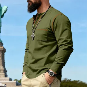 Outdoor detail view of men's vintage contrast stitch long sleeve henley shirt with chest pocket.