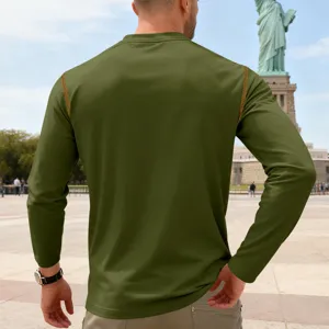 Men's olive green long sleeve t-shirt featuring contrast stitching detail and outdoor style backdrop.