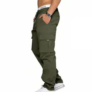 Close-up detail of military green men's cargo pants featuring multiple utility pockets and cords.