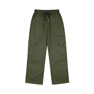 Detailed view of the army green cargo pants showing multi-pockets and elastic drawstring waist.