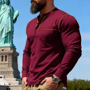 Detail of men's vintage contrast stitching long sleeve henley shirt with chest pocket.