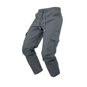 Men dark grey cargo pants detail showing durable twill fabric and multi pockets design.