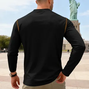 Men's black long sleeve top with contrast stitching detail, casual outdoor wear design, comfortable.