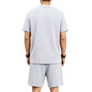 Detailed back view of men casual textured short sleeve t shirt and matching shorts apparel.