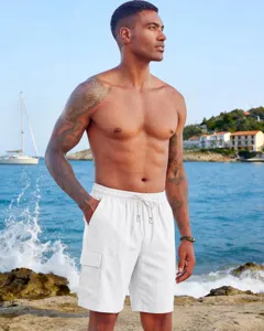 Men's white linen cargo shorts casual summer beach multi-pocket drawstring trousers.