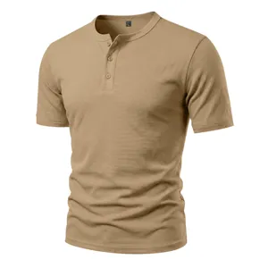 Men's khaki short sleeve waffle knit Henley shirt detail showcasing collar and buttons.
