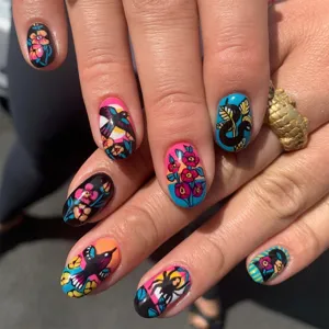 Vibrant retro tattoo style press-on nail stickers with colorful floral and animal art.