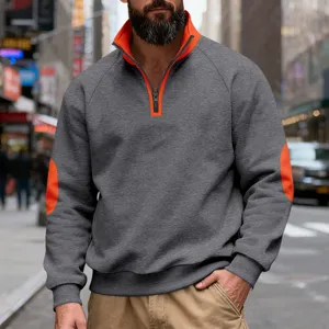 Men's casual quarter-zip fleece sweatshirt with contrast orange collar and elbow patches.