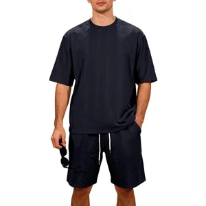 Detail view of the dark navy blue knit jacquard fabric texture on the casual men's shorts set.