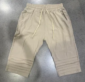 Men's casual summer shorts detail, drawstring waist and stylish pleated hem design.