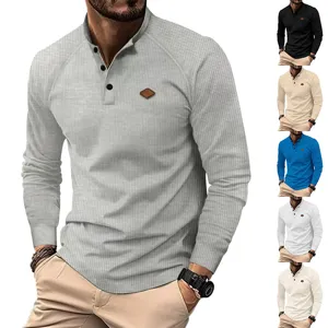 Men's casual waffle long sleeve stand collar henley shirt with buttons and chest patch.