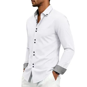 Detail view of men's white long sleeve dress shirt with contrast print cuffs and collar.