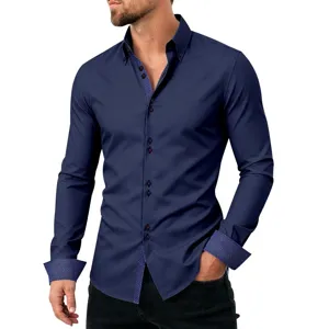 Detailed view of dark blue long sleeve mens shirt with contrast polka dot collar and cuffs.