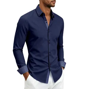 Men's solid navy long-sleeve dress shirt with contrast print details and button closure.