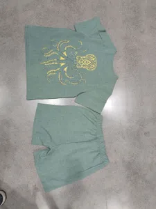 Men's linen set detail view, vintage Viking octopus print short sleeve shirt and shorts outfit.