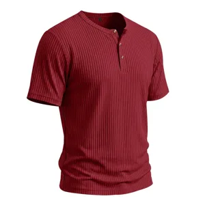Close-up detail of wine red men's short sleeve ribbed Henley shirt with three buttons.
