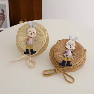 Kids straw crossbody bag with cute rabbit patch, round woven toddler coin purse for summer.