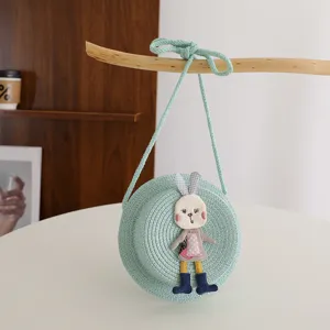 Kids round straw crossbody bag, cute bunny rabbit plush decor, spring summer fashion purse.