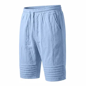 Detail view of light blue men's casual shorts, featuring drawstring waist and pleats.
