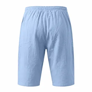 Detailed view of light blue men's casual linen shorts featuring a comfortable elastic waist.