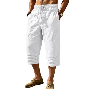 Details of men white casual linen 3/4 shorts with drawstring waist and pleated hem design.