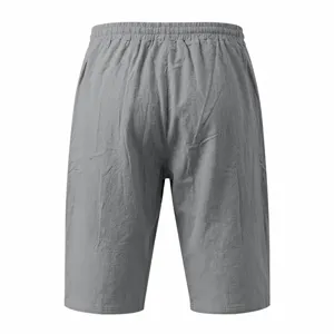 Detailed back view of men's casual solid gray cropped pants with elastic drawstring waist.