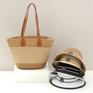 Stylish straw tote bag and sun hat set with elegant flower decoration for summer beach travel.