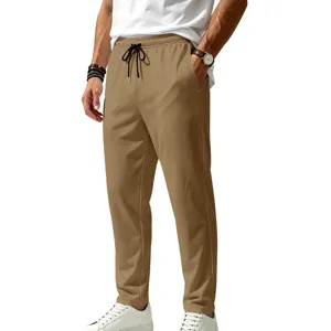 Detail view of men's casual sports pants, breathable quick-dry fabric, comfortable drawstring waist.
