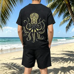 Back detail of men black slub linen outfit with vintage Viking octopus graphic on beach scene.