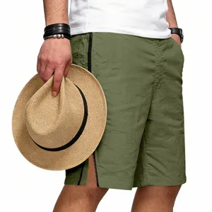 Shorts de sport décontractés verts pour hommes avec zip, coupe ample pour l'été streetwear.