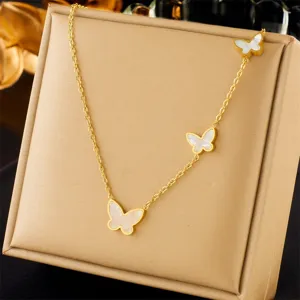 Gold plated stainless steel necklace featuring three charming white butterfly pendants for women.